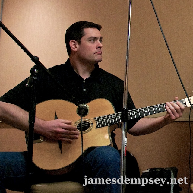 Nathan Eror playing a gypsy guitar
