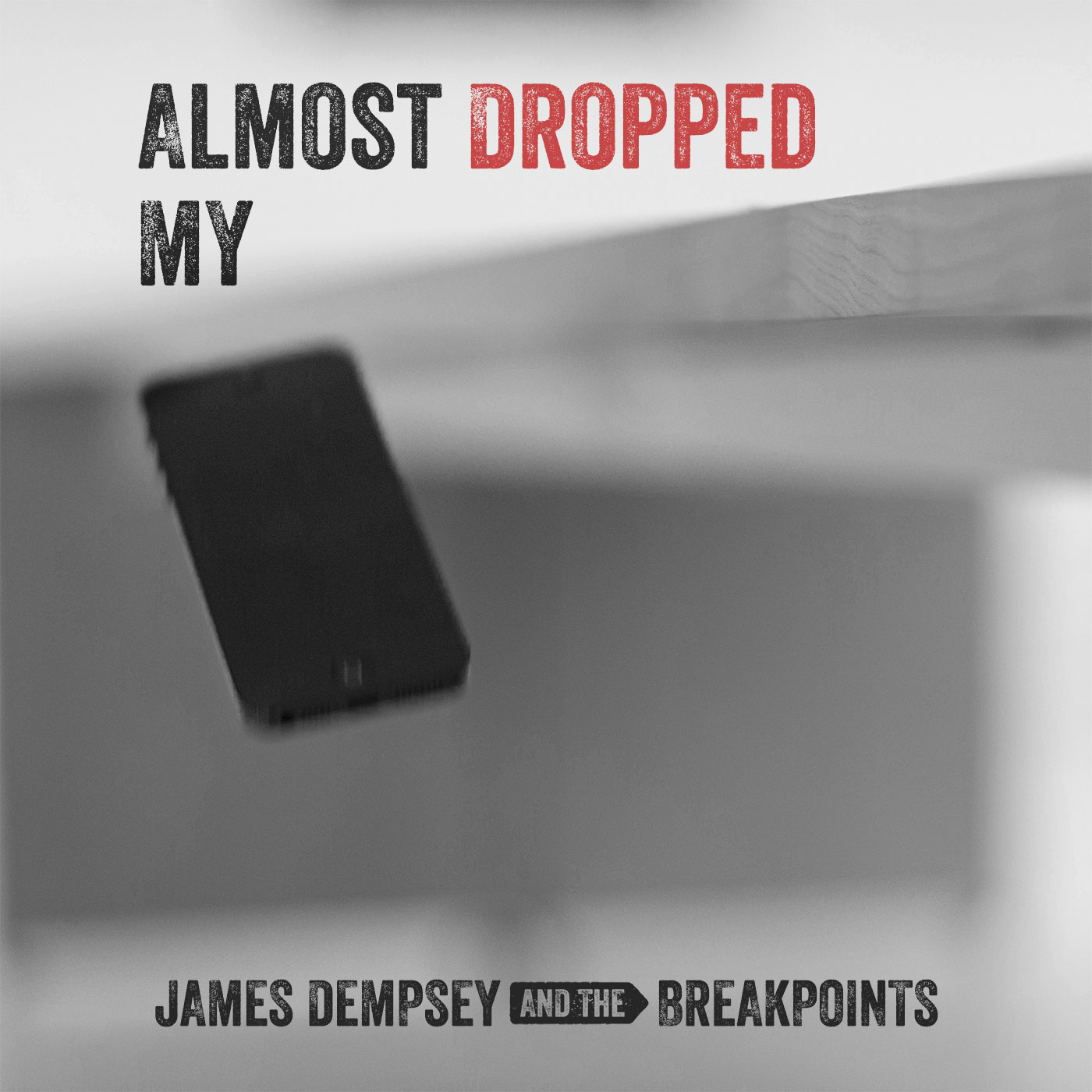 Cover art for 'Almost Dropped My iPhone' by James Dempsey and the Breakpoints. A black and white photo showing an iPhone in midair.