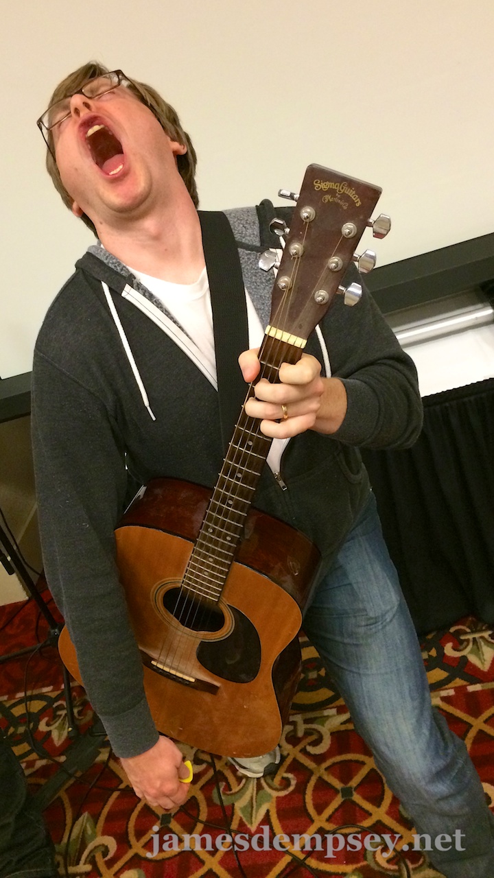 Jonathan Penn strikes a dramatic pose with his guitar