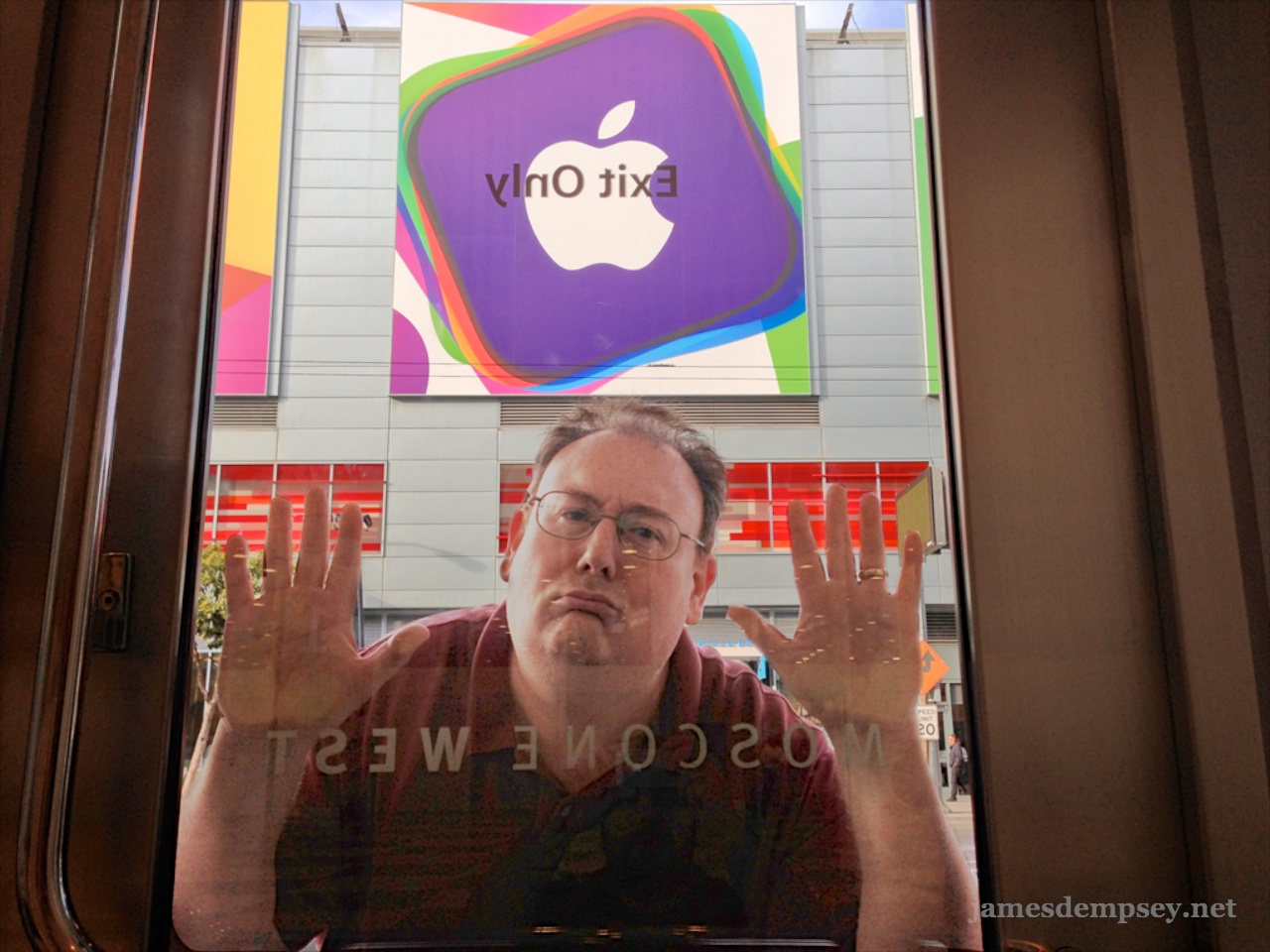 James Dempsey with hands and face pressed up against door to Moscone West, unable to get into WWDC