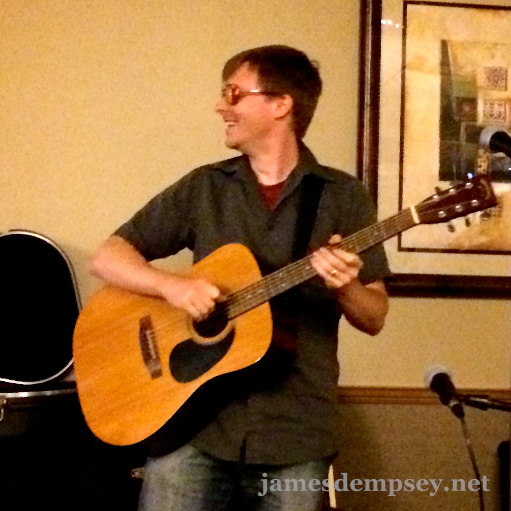 Jonathan Penn playing acoustic guitar